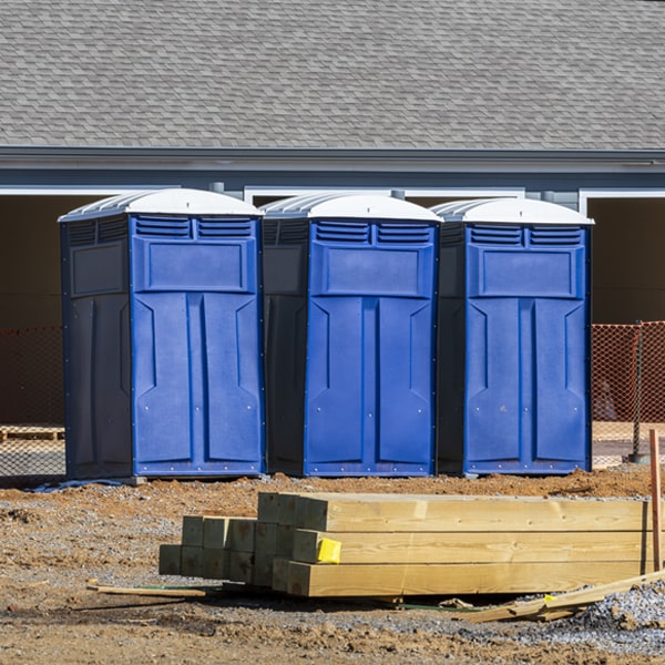 what is the cost difference between standard and deluxe portable restroom rentals in Kingston